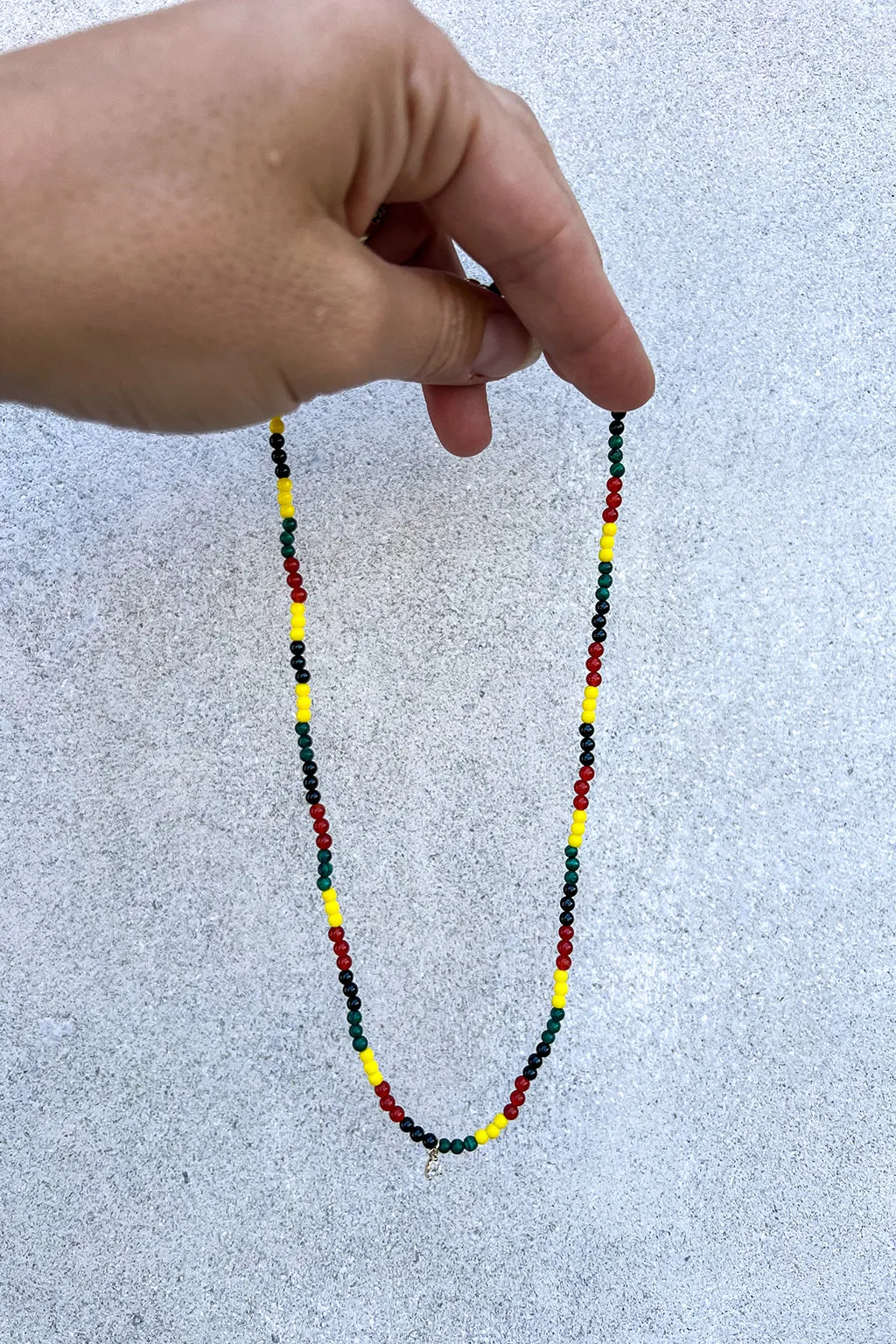 ENAMEL AND PEAR CUT DIAMOND RASTA NECKLACE IN 18K YELLOW GOLD