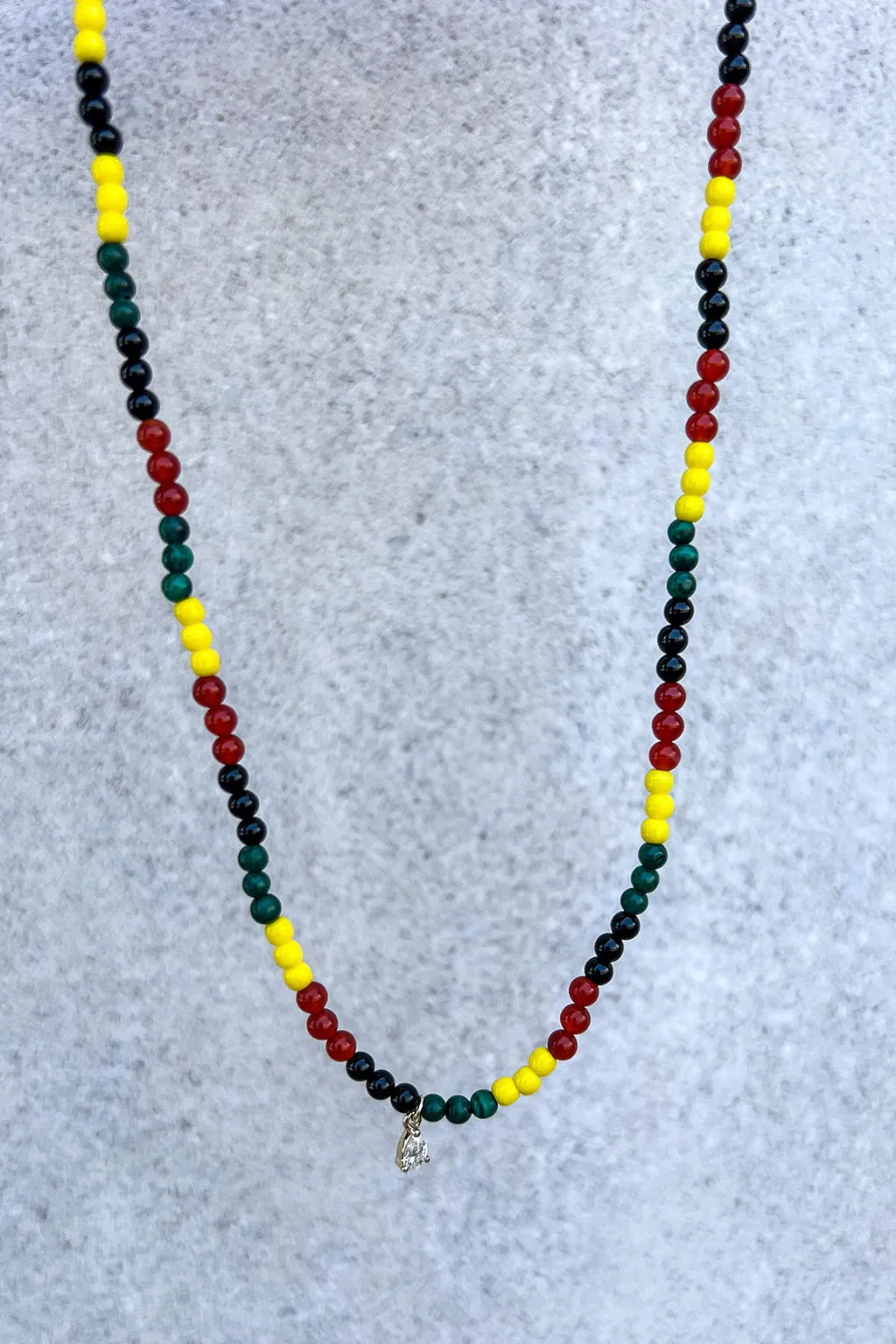 ENAMEL AND PEAR CUT DIAMOND RASTA NECKLACE IN 18K YELLOW GOLD