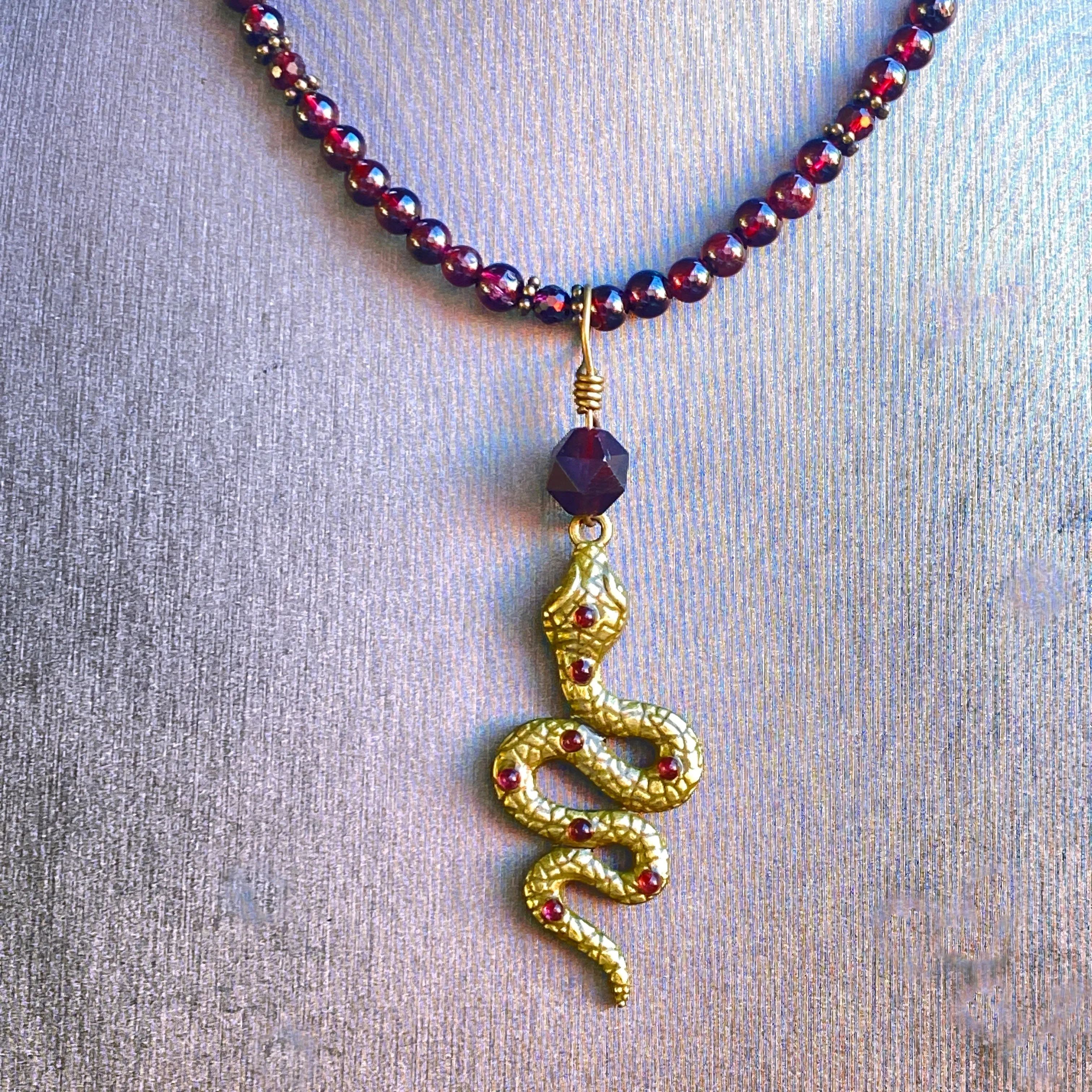 Garnet gemstone and Brass Snake pendant Necklace